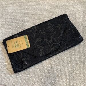 Jessica Simpson black embroidered clutch with snap closure and zip pocket - NEW